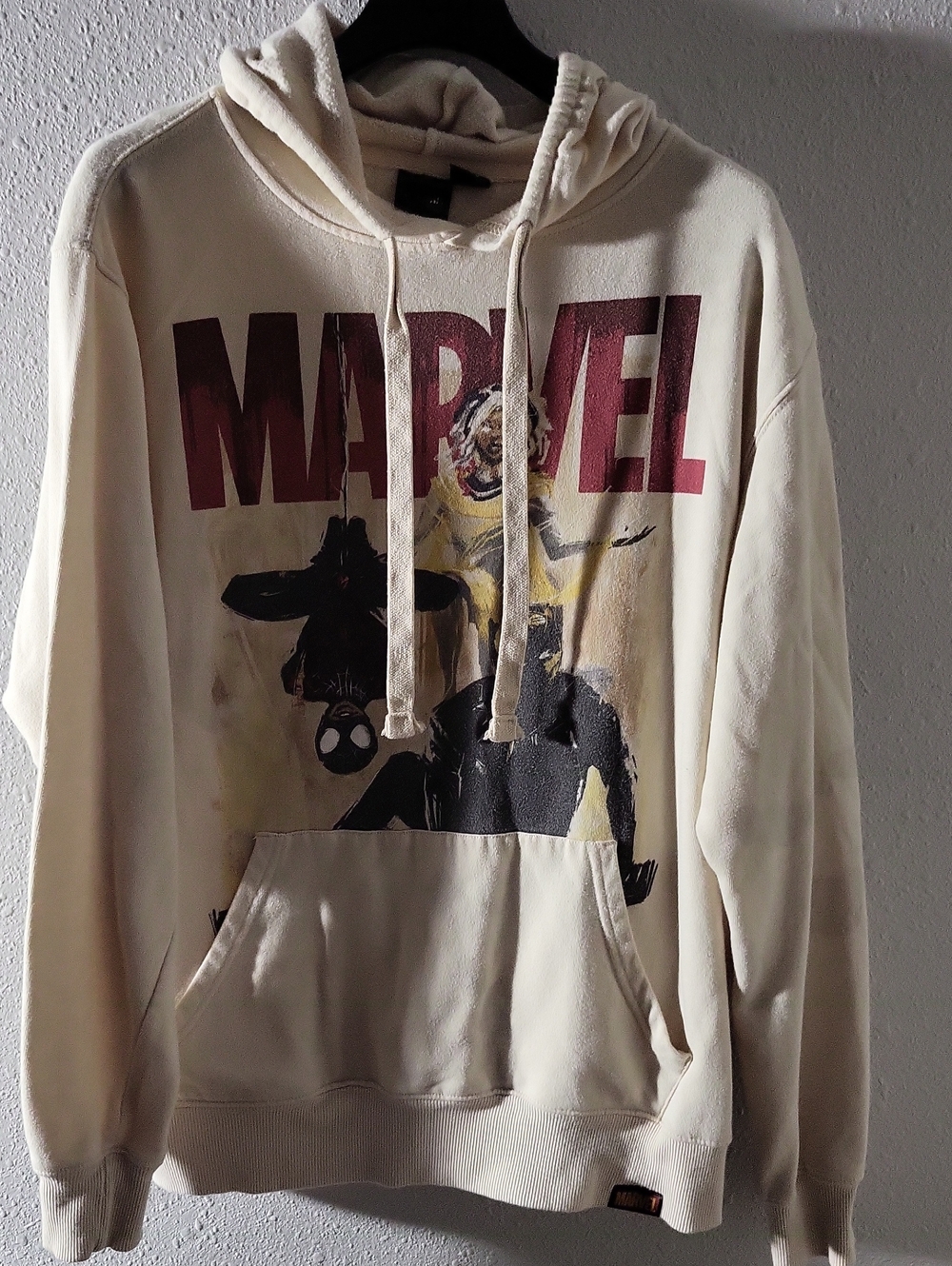 Marvel Cream Pullover Hoodie with Red Logo and Black Graphic